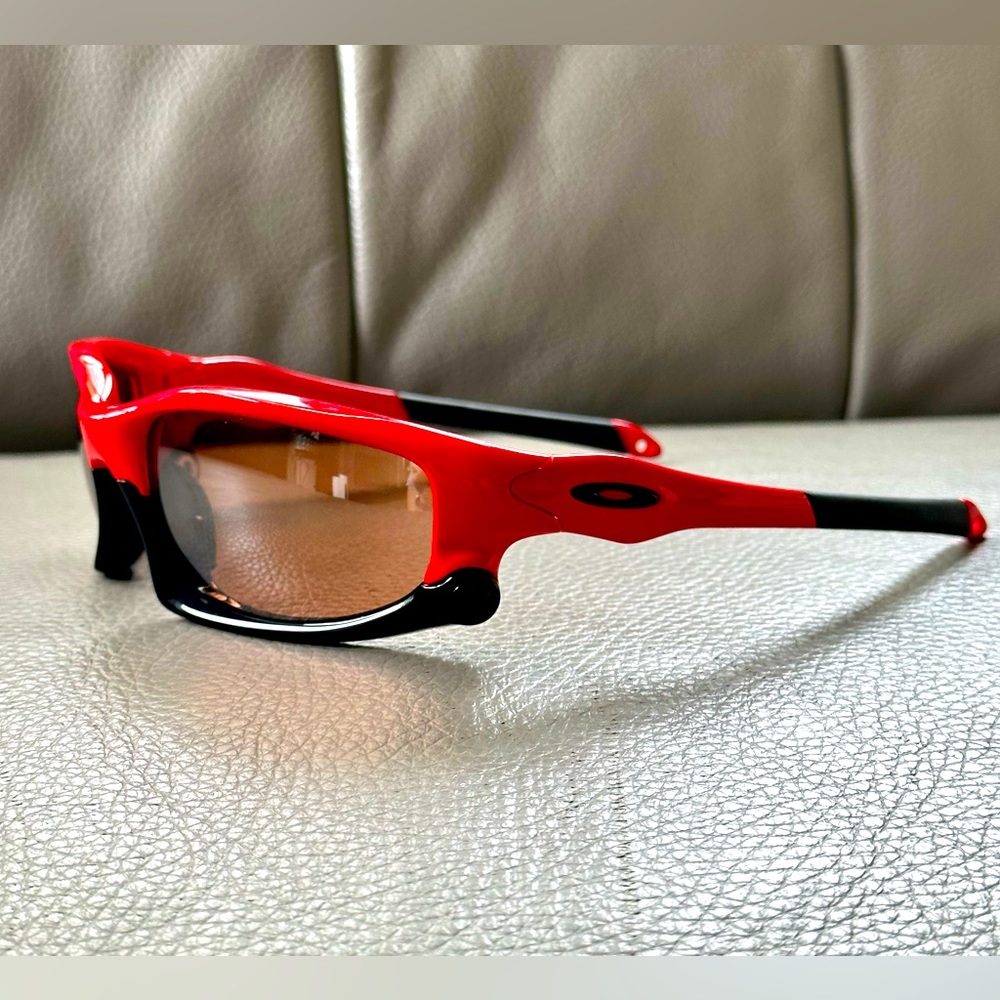 Red and black Oakley split jacket sunglasses